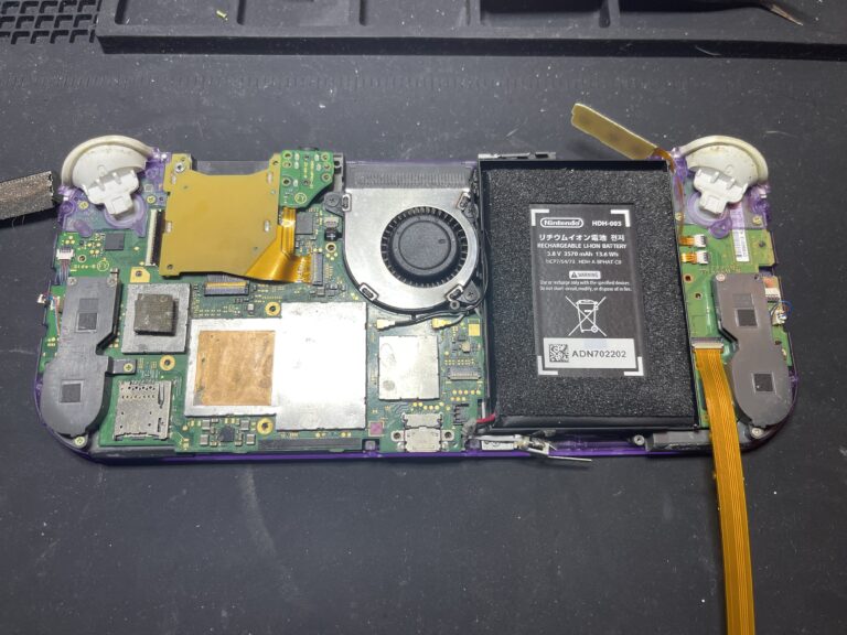 Replacing the ribbon cable that tells the console to turn on.